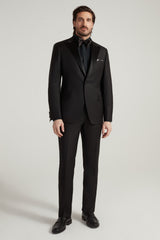 Samuelsohn black peak lapel tuxedo on model, front - Oak Hall